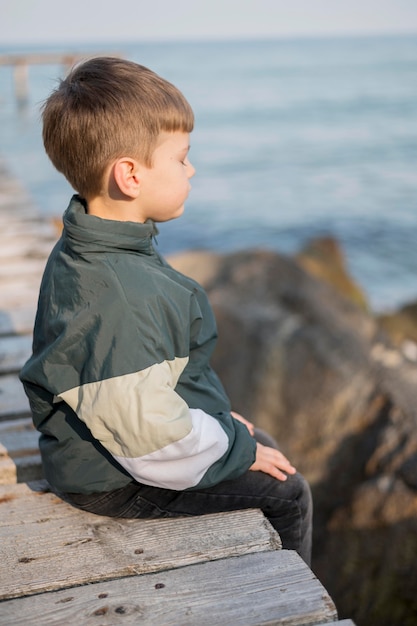 Side view boy at seaside