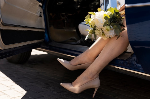 Side view bride holding flowers