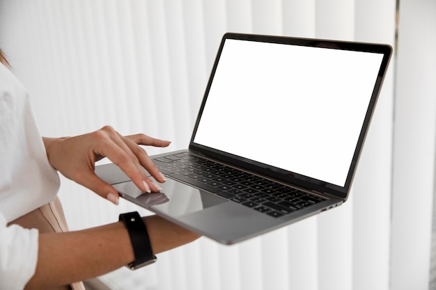 Side view of businesswoman with laptop