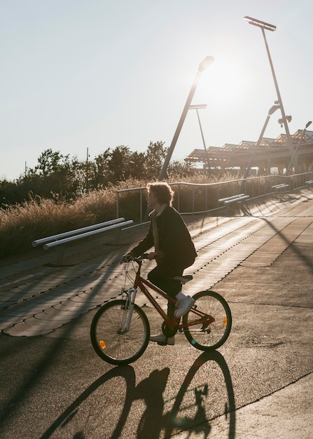 Side view of child on bike outside having fun