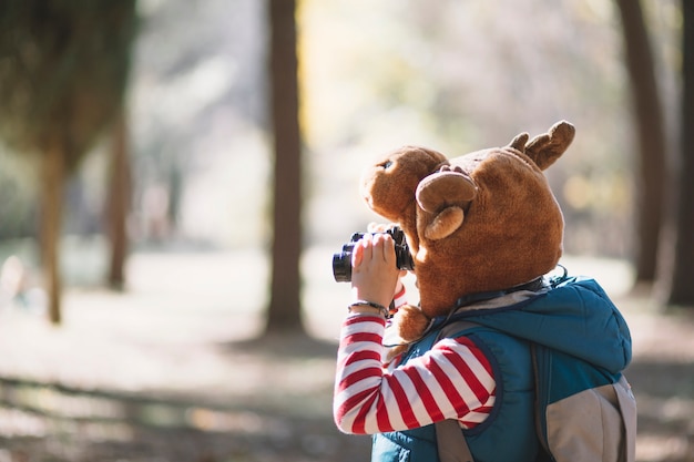 Side view child with binoculars