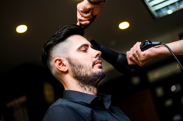 Side view costumer at beauty salon