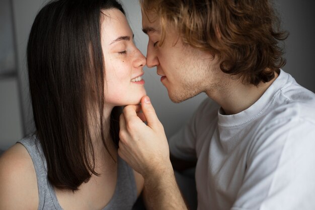 Side view of couple almost kissing