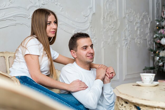 Side view of couple holding hands