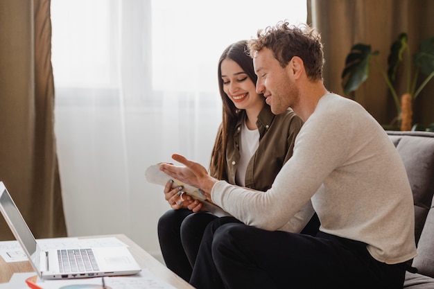 Side view of couple making plans to remodel the home together