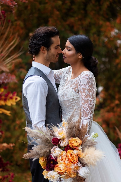 Side view couple posing at wedding