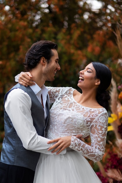 Side view couple posing at wedding