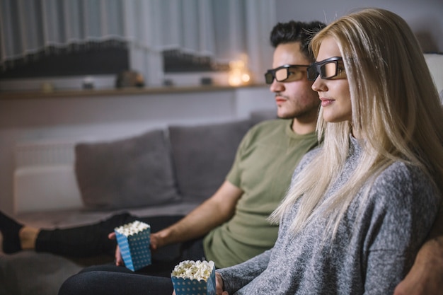 Side view couple watching movie