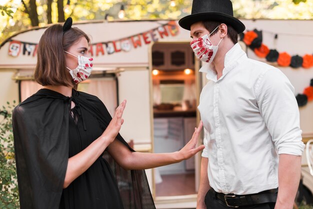 Side view couple wearing masks