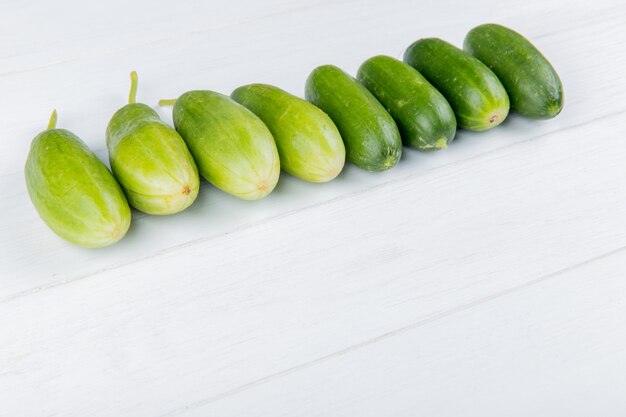 Side view of cucumbers on wooden surface