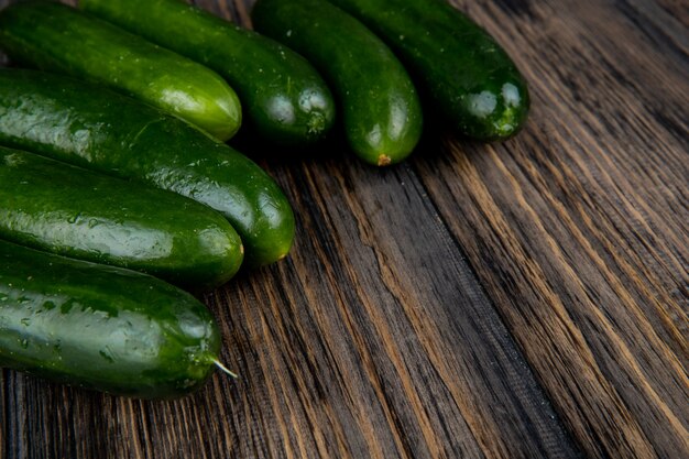 Side view of cucumbers on wooden surface