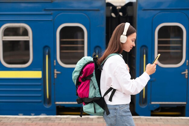 Side view cute girl at the railway station