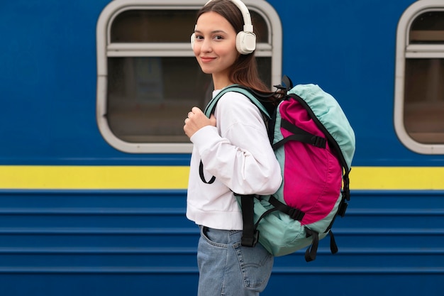 Side view cute girl at the railway station