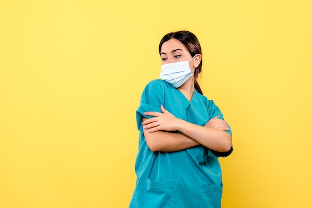 Side view of a doctor woman in medical uniform has the chills