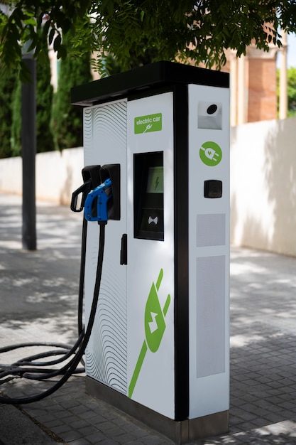 Free photo side view electric car charging station