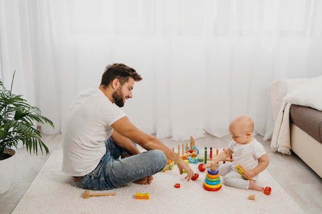 Side view of father and child playing together