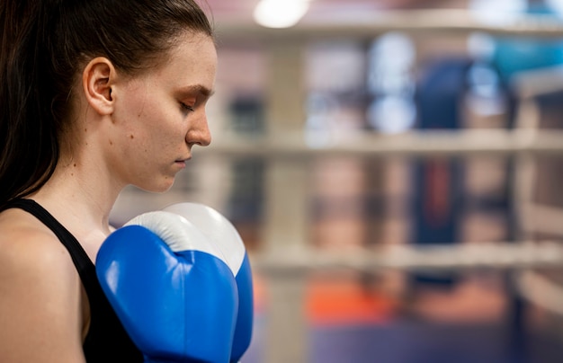 Side view of female boxer with copy space