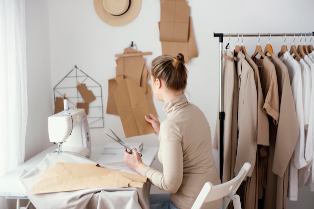 Side view of female tailor working