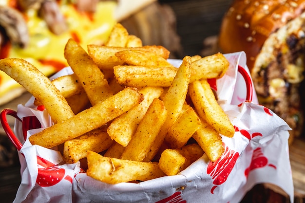 Side view french fries with seasoning