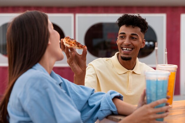 Side view friends partying with food