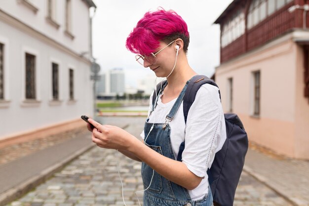 Side view girl holding smartphone