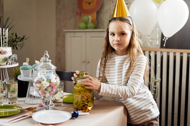 Side view girl wearing party hat