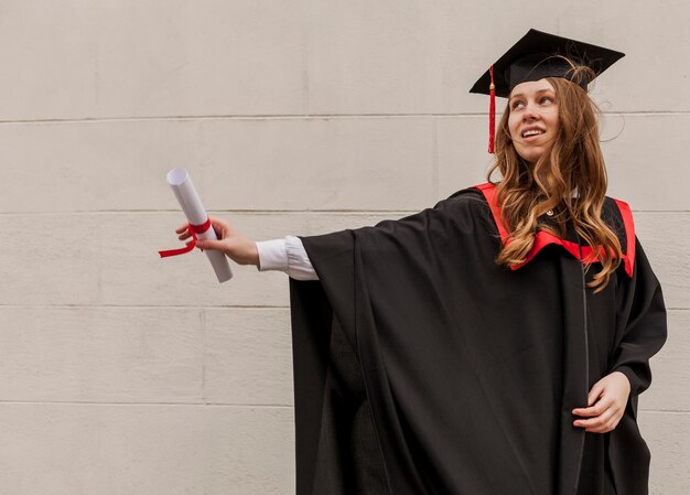 Side view girl with diploma