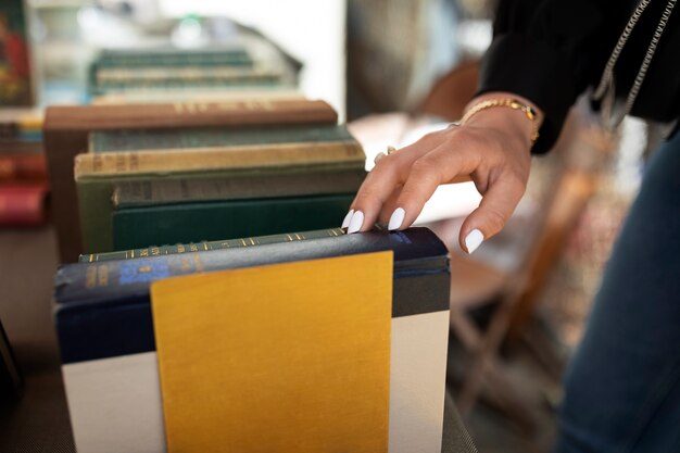 Side view hand touching old book