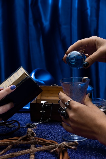 Free photo side view hands holding cup and book