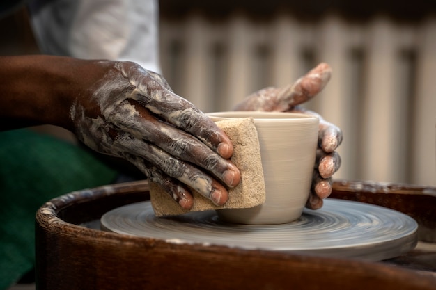 Side view hands making bowl