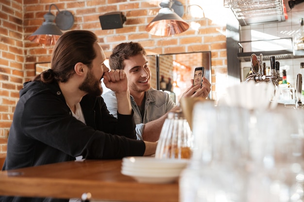 Side view of Happy Friends near the bar