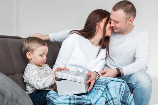 Side view of happy parents with baby