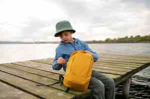 Free photo side view kid exploring natural environment