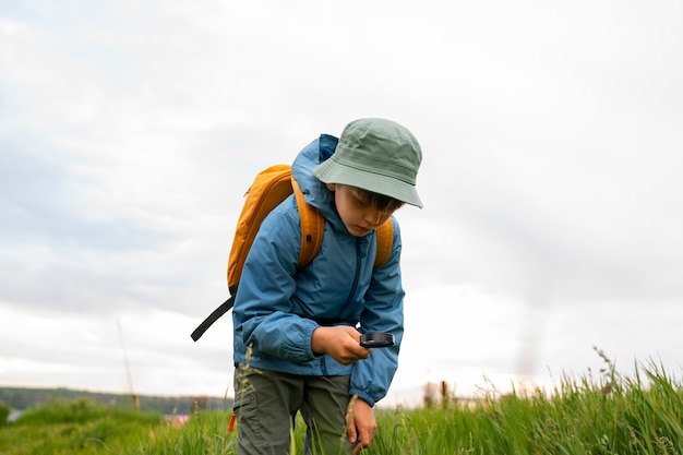 Free photo side view kid exploring natural environment