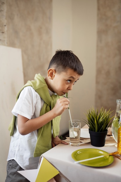 Side view kid with drink