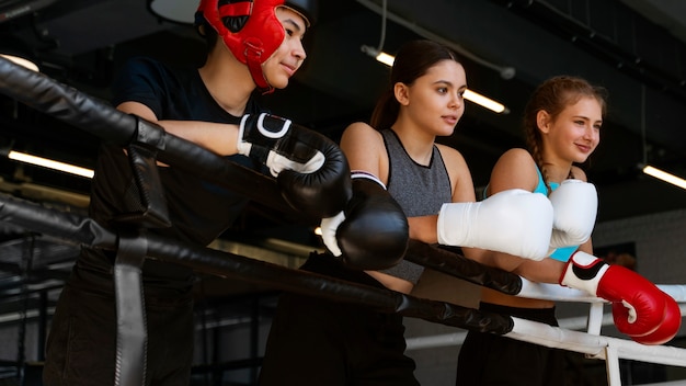 Free Photo side view kids learning boxing