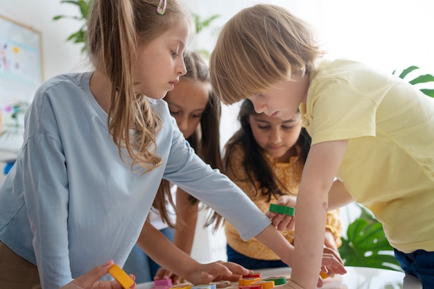 Side view kids learning with toys