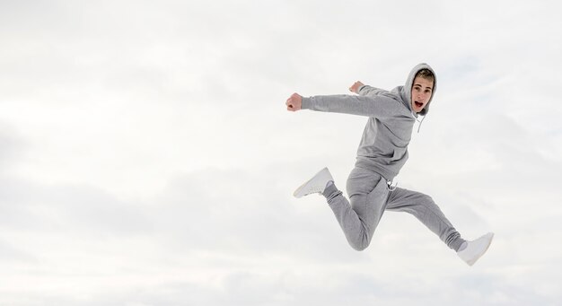 Side view of male dancer posing while dancing