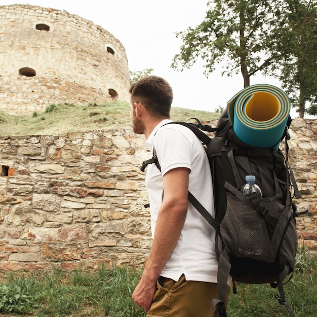 Free Photo side view man at castle ruins