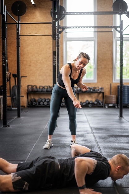 Free photo side view man doing burpees