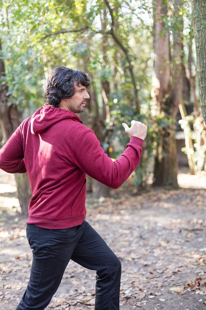 Free Photo side view of man doing warm-ups