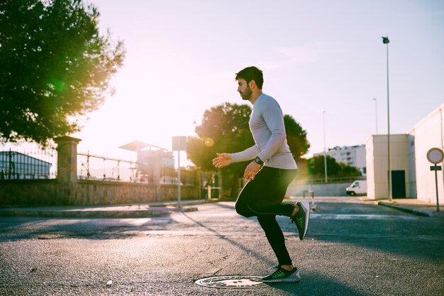 Side view man exercising in mornin