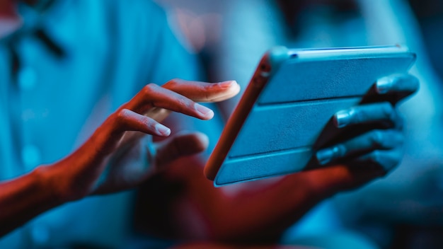 Free Photo side view of man at home using tablet