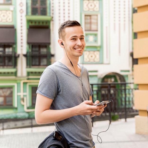 Side view man listening music