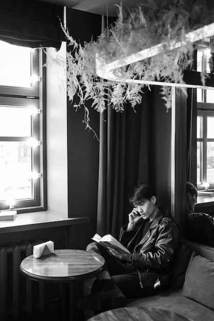 Free Photo side view man sitting in coffee shop