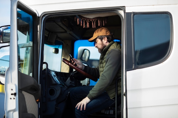 Side view man sitting in truck