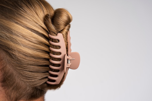 Free Photo side view man wearing big hair clip