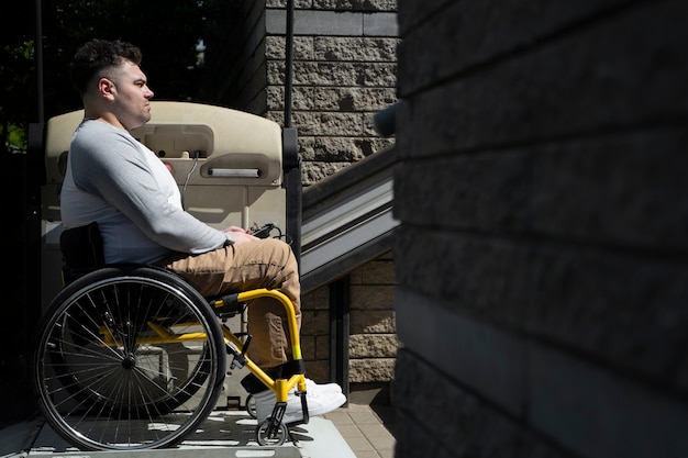 Side view man in wheelchair