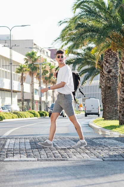 Free Photo side view of man with backpack exploring city