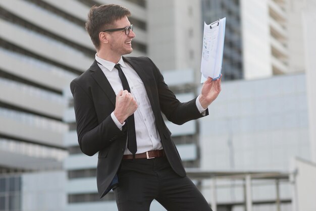 Side view man with clipboard